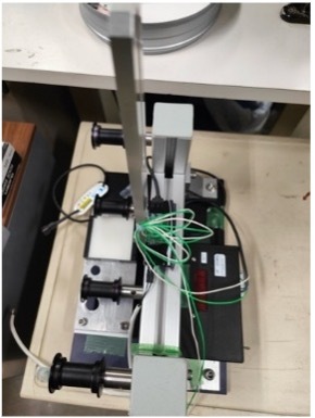 A machine with wires and wiresDescription automatically generated